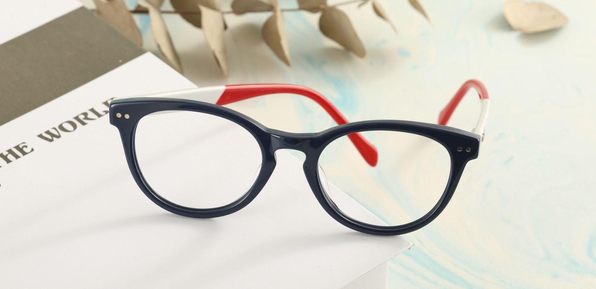 Revere Oval Prescription Glasses - The Frame Is Blue And Red